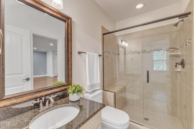 644 Angelica Cir, Cary, NC 27518 - full bathroom featuring a shower stall, vanity, toilet, and recessed lighting