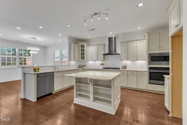 644 Angelica Cir, Cary, NC 27518 - kitchen with appliances with stainless steel finishes, wall chimney range hood, a peninsula, open shelves, and ornamental molding