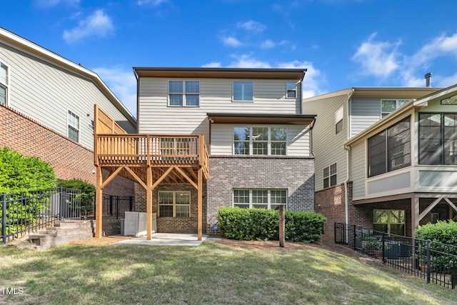 644 Angelica Cir, Cary, NC 27518 - rear view of house featuring brick siding, a patio area, and a wooden deck