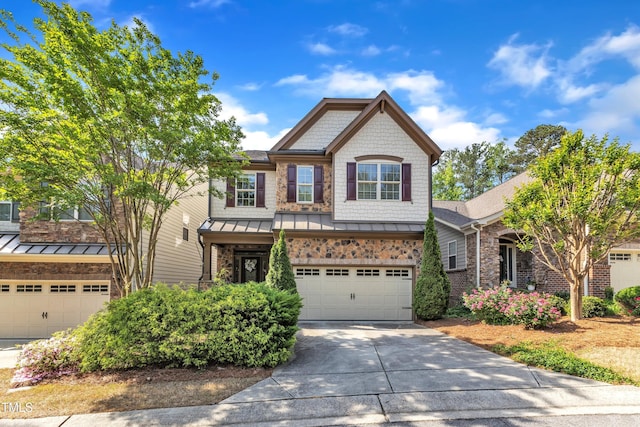 644 Angelica Cir, Cary, NC 27518 - view of front of home with a standing seam roof, concrete driveway, a garage, metal roof, and stone siding