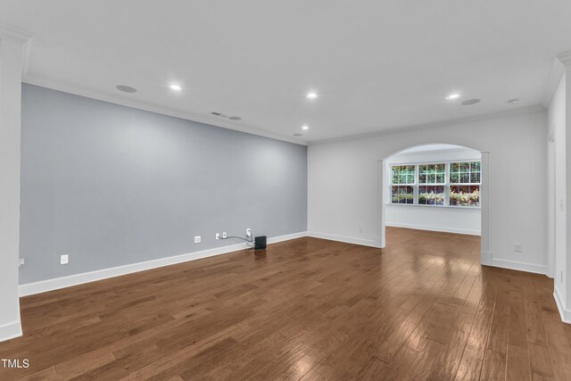 644 Angelica Cir, Cary, NC 27518 - unfurnished room with ornamental molding, dark wood-style floors, recessed lighting, arched walkways, and baseboards