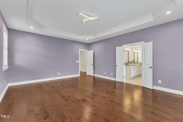 644 Angelica Cir, Cary, NC 27518 - unfurnished bedroom featuring a tray ceiling, ornamental molding, wood finished floors, recessed lighting, and baseboards