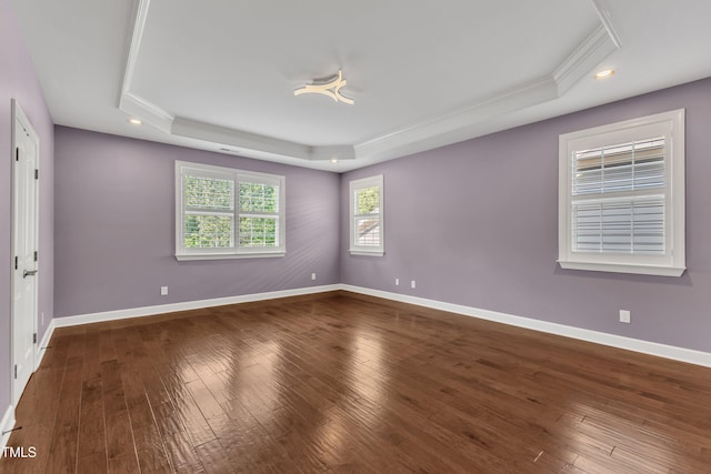 644 Angelica Cir, Cary, NC 27518 - spare room featuring a tray ceiling, crown molding, hardwood / wood-style floors, baseboards, and recessed lighting