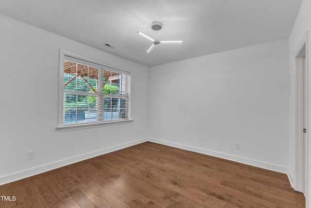 644 Angelica Cir, Cary, NC 27518 - spare room with baseboards and wood finished floors