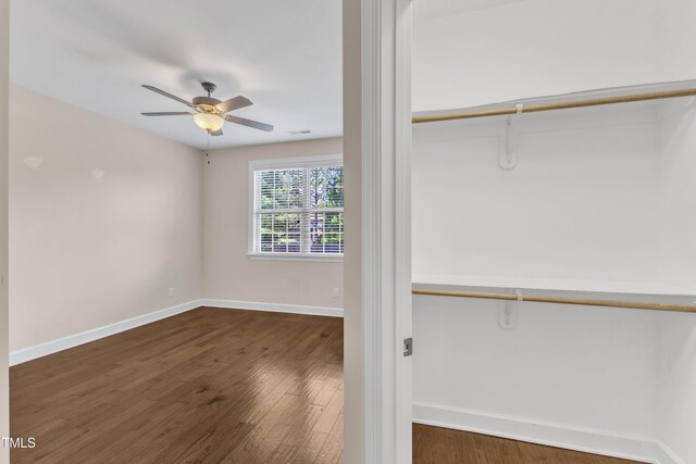 644 Angelica Cir, Cary, NC 27518 - unfurnished bedroom with wood finished floors, baseboards, a closet, and ceiling fan