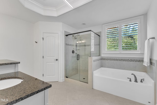 644 Angelica Cir, Cary, NC 27518 - bathroom featuring tile patterned floors, a bath, a shower stall, and vanity