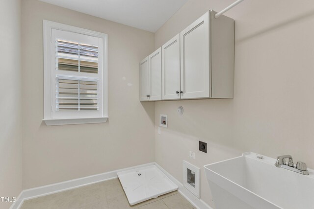 644 Angelica Cir, Cary, NC 27518 - laundry room featuring cabinet space, electric dryer hookup, hookup for a washing machine, baseboards, and light tile patterned floors