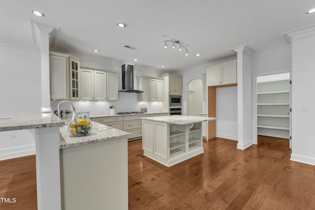 644 Angelica Cir, Cary, NC 27518 - kitchen featuring wall chimney range hood, crown molding, stainless steel appliances, a peninsula, and light stone countertops