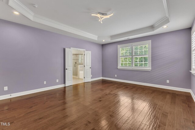 644 Angelica Cir, Cary, NC 27518 - spare room featuring a raised ceiling, ornamental molding, wood-type flooring, recessed lighting, and baseboards