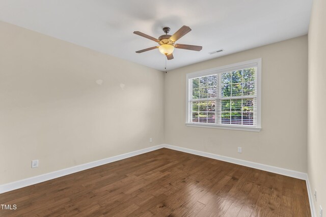 644 Angelica Cir, Cary, NC 27518 - unfurnished room with baseboards, ceiling fan, and dark wood finished floors