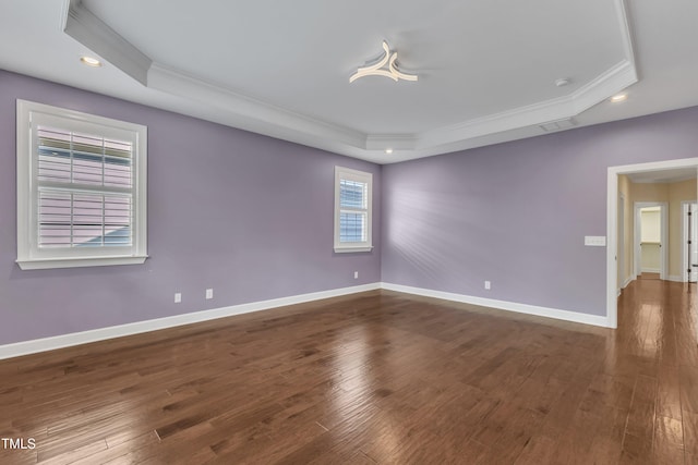 644 Angelica Cir, Cary, NC 27518 - empty room featuring a tray ceiling, crown molding, recessed lighting, wood-type flooring, and baseboards