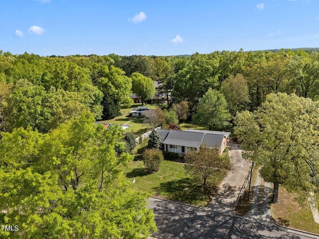drone / aerial view with a view of trees