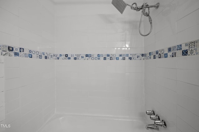 interior details with shower / bathing tub combination