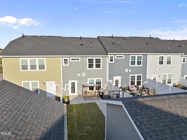 6511 Academic Ave, Raleigh, NC 27616 - back of property featuring cooling unit, outdoor lounge area, roof with shingles, and a patio