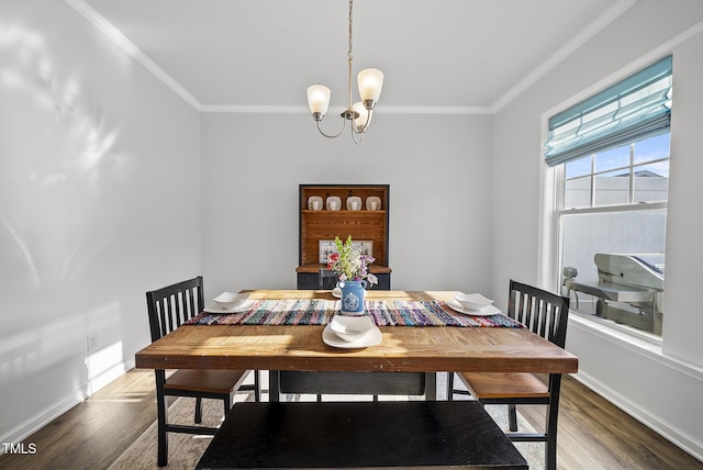 6511 Academic Ave, Raleigh, NC 27616 - dining room with wood finished floors, crown molding, baseboards, and a notable chandelier