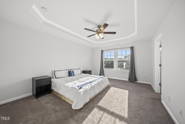 6511 Academic Ave, Raleigh, NC 27616 - carpeted bedroom featuring a raised ceiling, baseboards, and ceiling fan