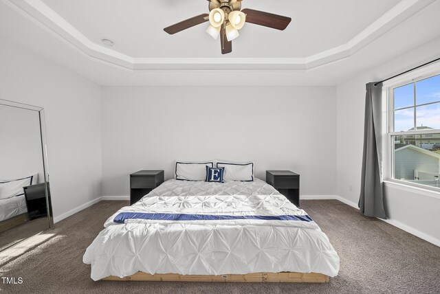 6511 Academic Ave, Raleigh, NC 27616 - bedroom with a tray ceiling, a ceiling fan, carpet floors, crown molding, and baseboards