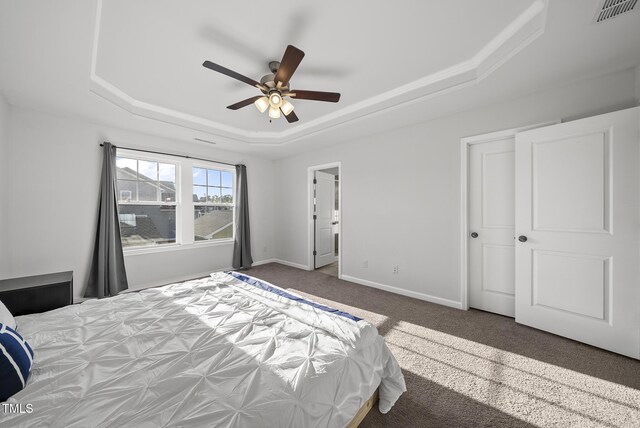 6511 Academic Ave, Raleigh, NC 27616 - bedroom featuring carpet, a raised ceiling, visible vents, a ceiling fan, and baseboards