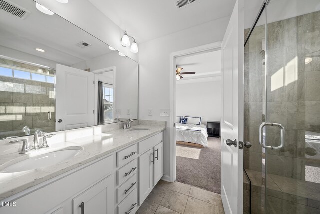 6511 Academic Ave, Raleigh, NC 27616 - ensuite bathroom featuring a sink, a shower stall, double vanity, and connected bathroom