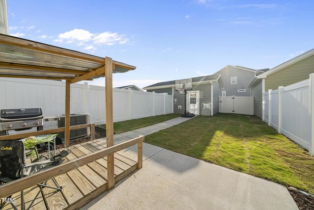6511 Academic Ave, Raleigh, NC 27616 - view of yard featuring a gate, a patio area, central AC, and a fenced backyard