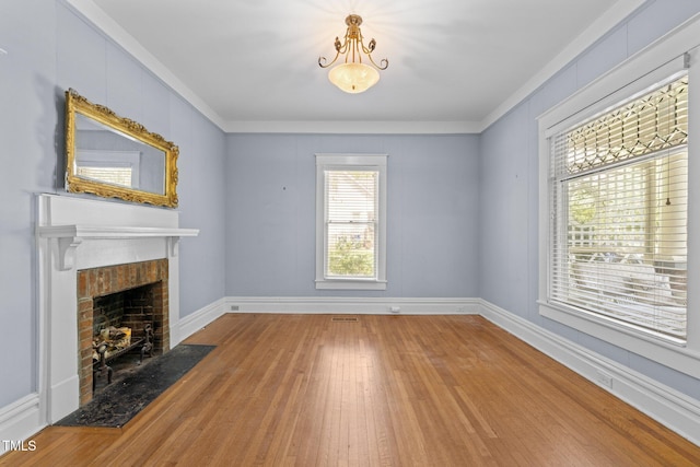 109 N Hassel St, Hillsborough, NC 27278 - unfurnished living room with a fireplace with flush hearth, wood-type flooring, and ornamental molding