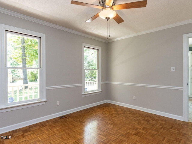 empty room with ceiling fan, a textured ceiling, visible vents, baseboards, and ornamental molding