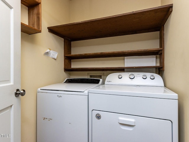 washroom with laundry area and washing machine and dryer