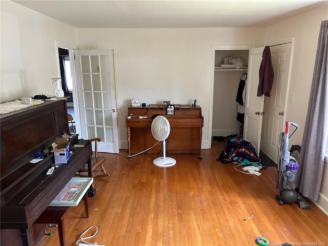 bedroom featuring wood finished floors and a closet