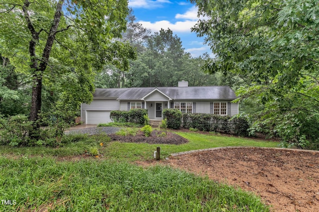 1311 Theodore Ln, Durham, NC 27703 - ranch-style home with an attached garage and a chimney