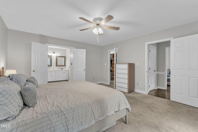 1311 Theodore Ln, Durham, NC 27703 - bedroom featuring carpet flooring, baseboards, ensuite bath, and a ceiling fan