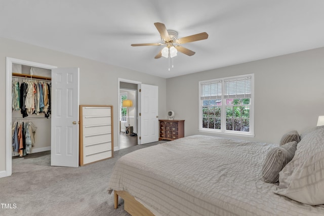 1311 Theodore Ln, Durham, NC 27703 - bedroom featuring carpet, a closet, a walk in closet, baseboards, and a ceiling fan