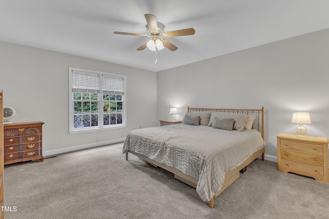 1311 Theodore Ln, Durham, NC 27703 - bedroom featuring baseboards, ceiling fan, and carpet floors