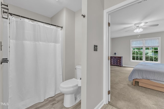 1311 Theodore Ln, Durham, NC 27703 - bathroom featuring toilet, ceiling fan, baseboards, curtained shower, and connected bathroom