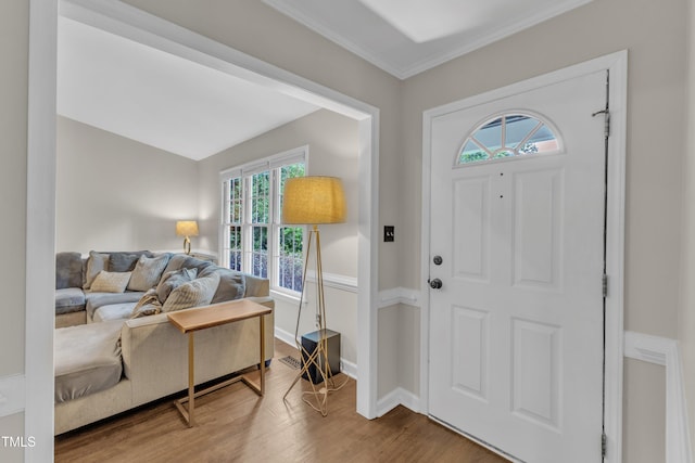 1311 Theodore Ln, Durham, NC 27703 - entryway featuring wood finished floors, baseboards, and ornamental molding