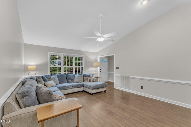 1311 Theodore Ln, Durham, NC 27703 - living area with vaulted ceiling, ceiling fan, wood finished floors, and baseboards