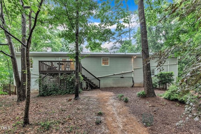 1311 Theodore Ln, Durham, NC 27703 - back of property with a wooden deck and stairway