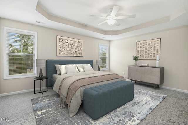 36 Slate Ln, Rocky Point, NC 28457 - carpeted bedroom with a tray ceiling, baseboards, and a ceiling fan