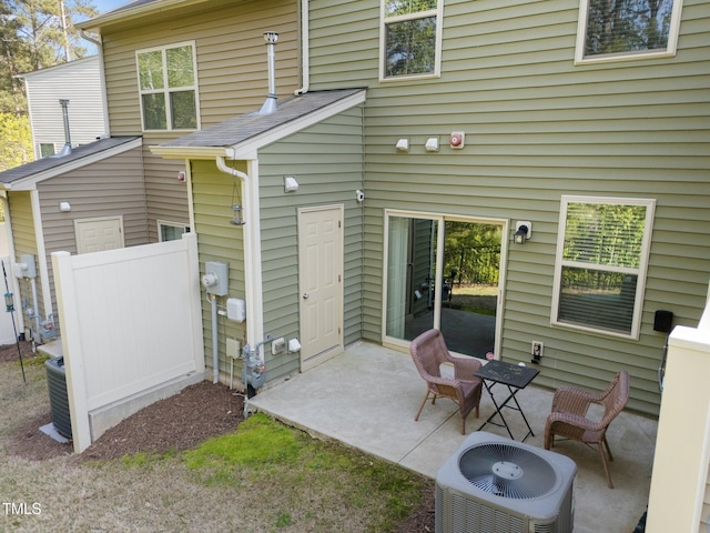 6230 Pesta Ct, Raleigh, NC 27612 - rear view of house featuring central AC unit and a patio area