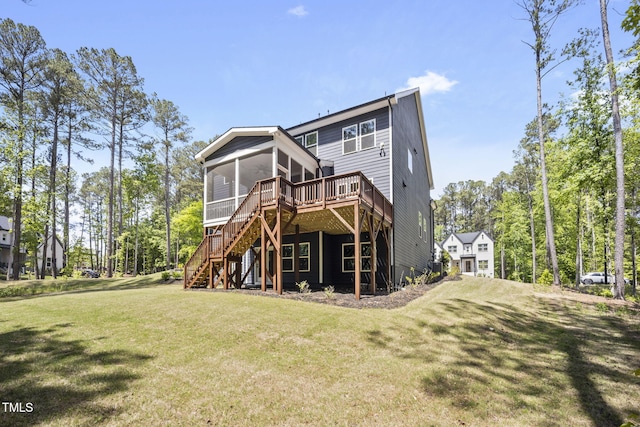 back of house with stairway, a lawn, a wooden deck, and a sunroom