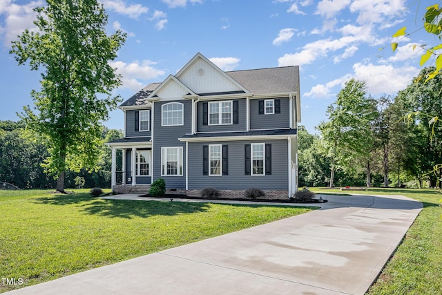 45 Leighann Ct S, Timberlake, NC 27583 - view of front of property with a front yard, board and batten siding, concrete driveway, and crawl space