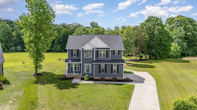 45 Leighann Ct S, Timberlake, NC 27583 - view of front of house with driveway, a front yard, a shingled roof, and a porch
