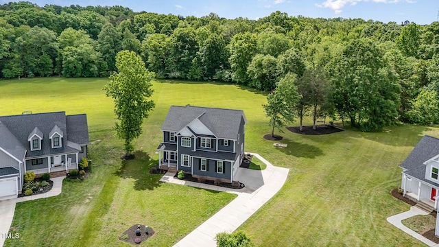 45 Leighann Ct S, Timberlake, NC 27583 - aerial view of property and surrounding area featuring a heavily wooded area