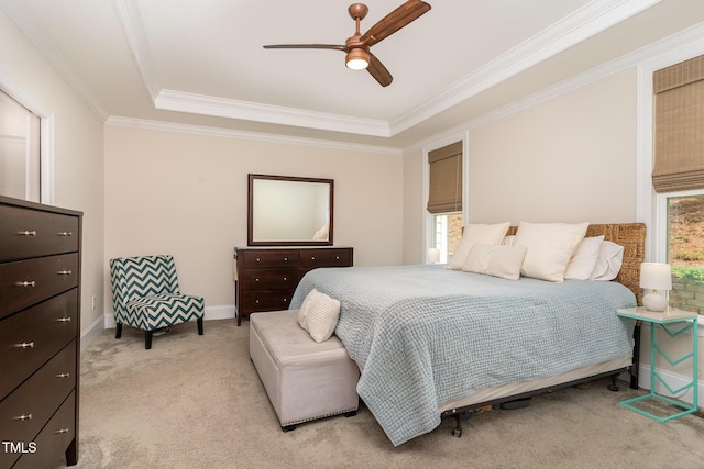 bedroom with light colored carpet, multiple windows, and ornamental molding