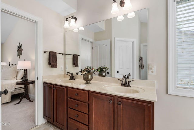 full bath featuring double vanity and a sink