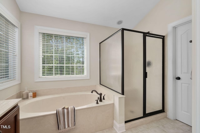 full bath featuring tile patterned floors, a bath, a shower stall, and vanity