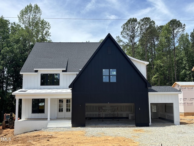 2391 Herbert Akins Rd, Fuquay Varina, NC 27526 - modern inspired farmhouse featuring a shingled roof, driveway, and french doors