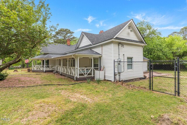 119 Johnson St, Broadway, NC 27505 - exterior space with a yard, a porch, fence, and a gate