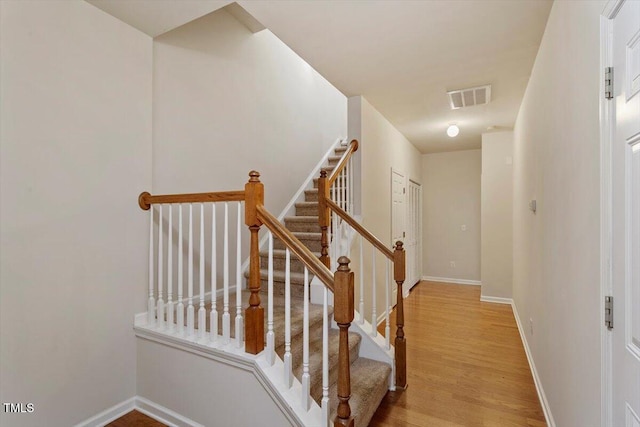 615 Carlton Commons Ln, Cary, NC 27519 - staircase featuring wood finished floors and baseboards