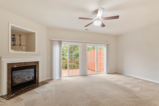 615 Carlton Commons Ln, Cary, NC 27519 - unfurnished living room featuring carpet flooring, a fireplace, ceiling fan, and baseboards