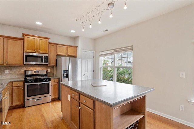 615 Carlton Commons Ln, Cary, NC 27519 - kitchen featuring stainless steel appliances, open shelves, light wood-style flooring, tasteful backsplash, and brown cabinetry